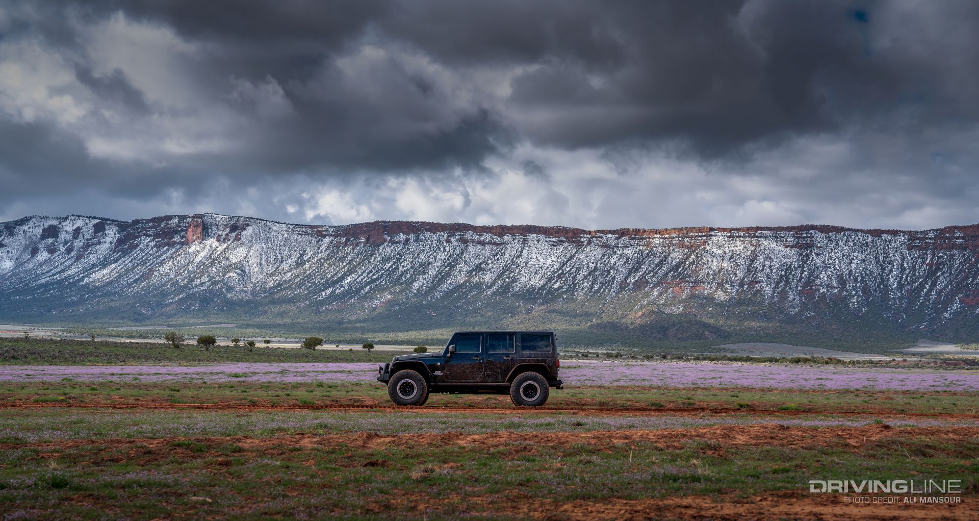 Jeep Wrangler JK in front of a mountain range