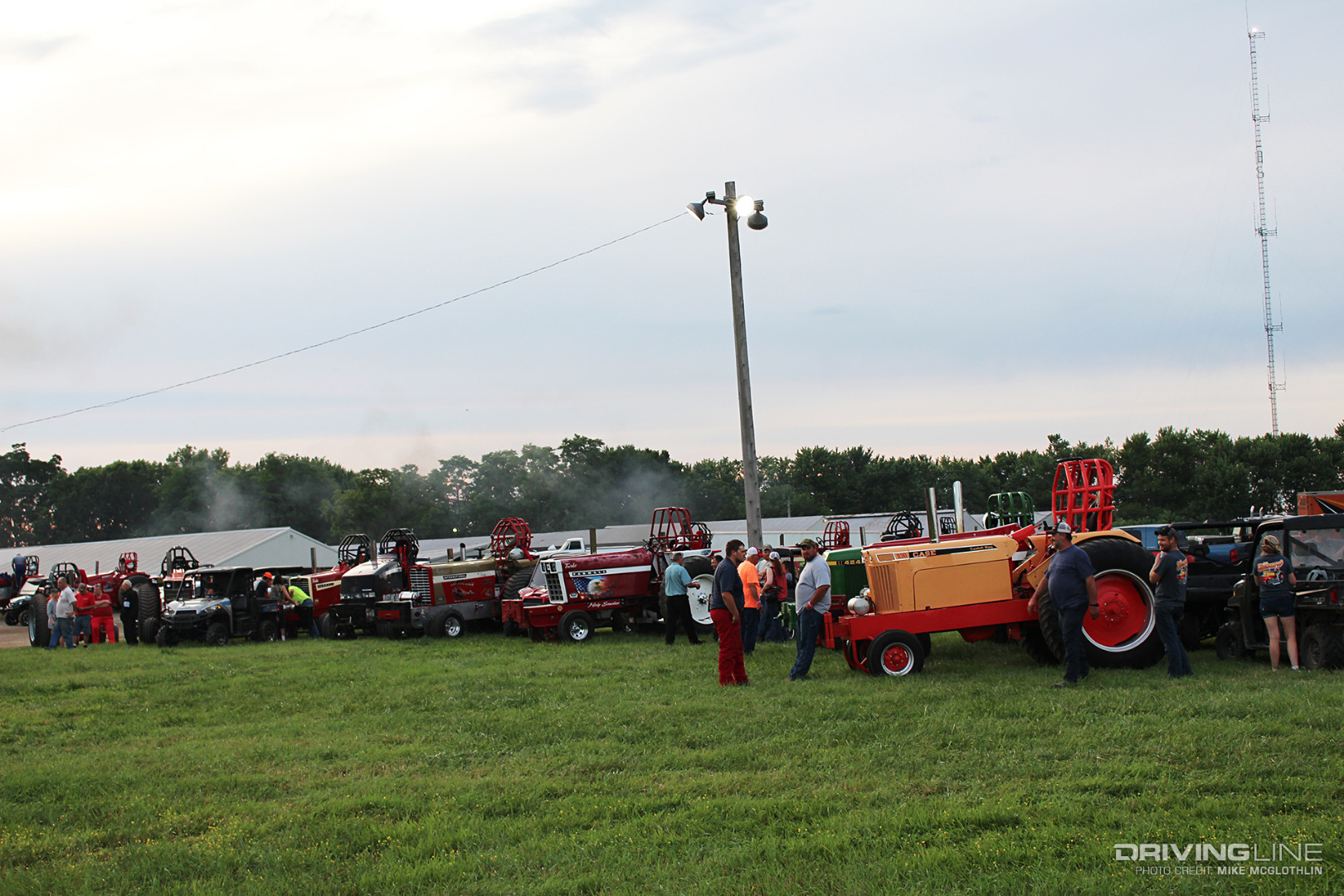 Tractor pull tractors in a field