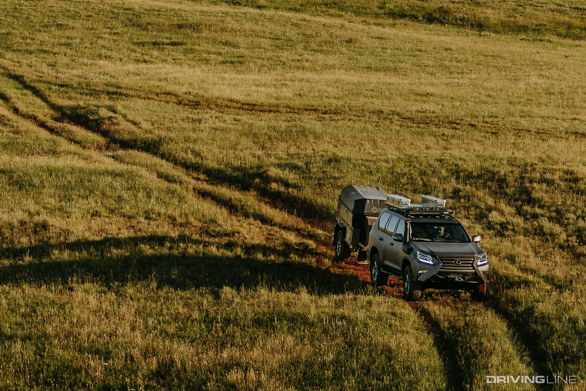 Lexus GXOR Concept driving through a field