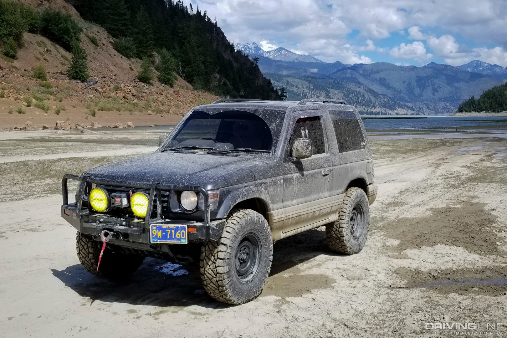 Mitsubishi Pajero with Nitto Ridge Grapplers and fifteen52 Analog HD wheels, after successfully driving through a deep muddy lake in Minto, Canada