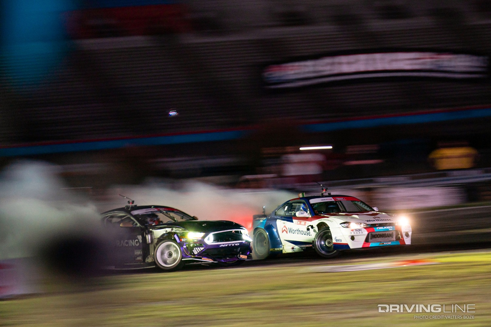 Chelsea Denofa sticks tight on James Deane's door in the final round battle at Formula Drift Texas