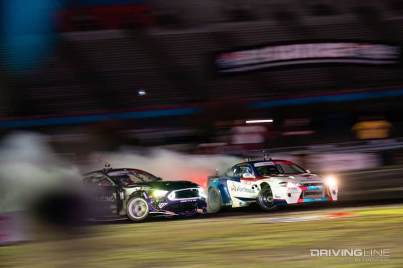 Chelsea Denofa sticks tight on James Deane's door in the final round battle at Formula Drift Texas