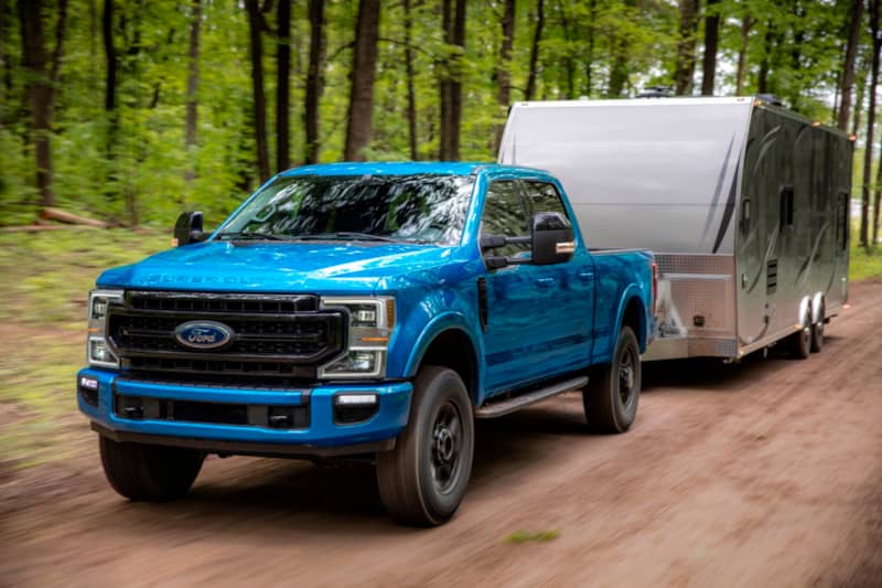 Ford F250 Tremor towing a trailer on a dirt road