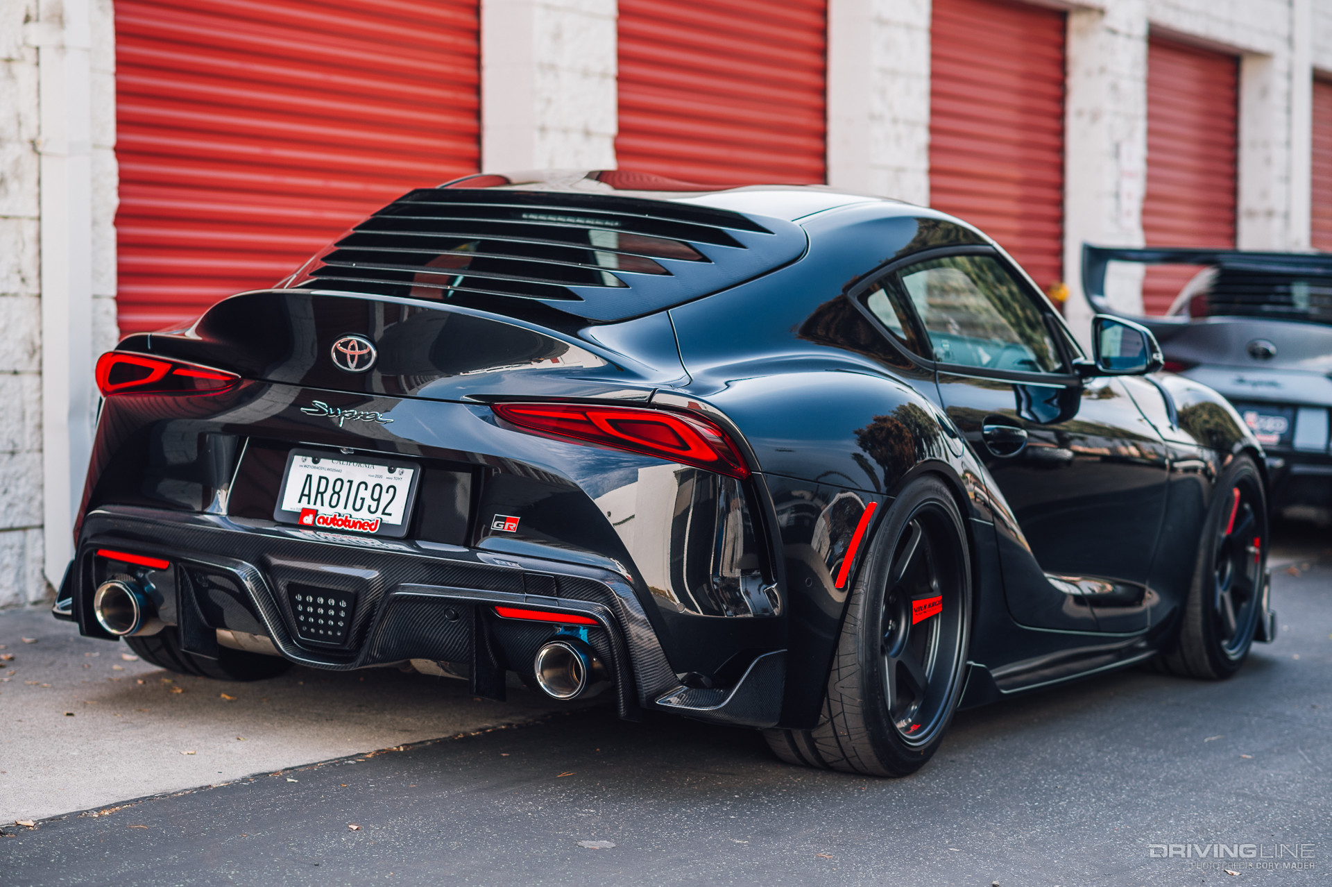 Rear of black GR Supra on Nitto INVO