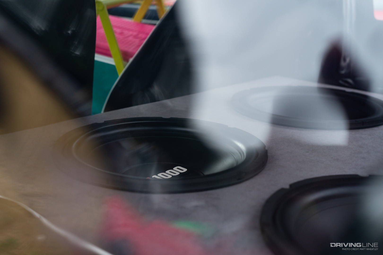 speakers in the trunk of a Suzuki Samurai and Igloo cooler in the front seat
