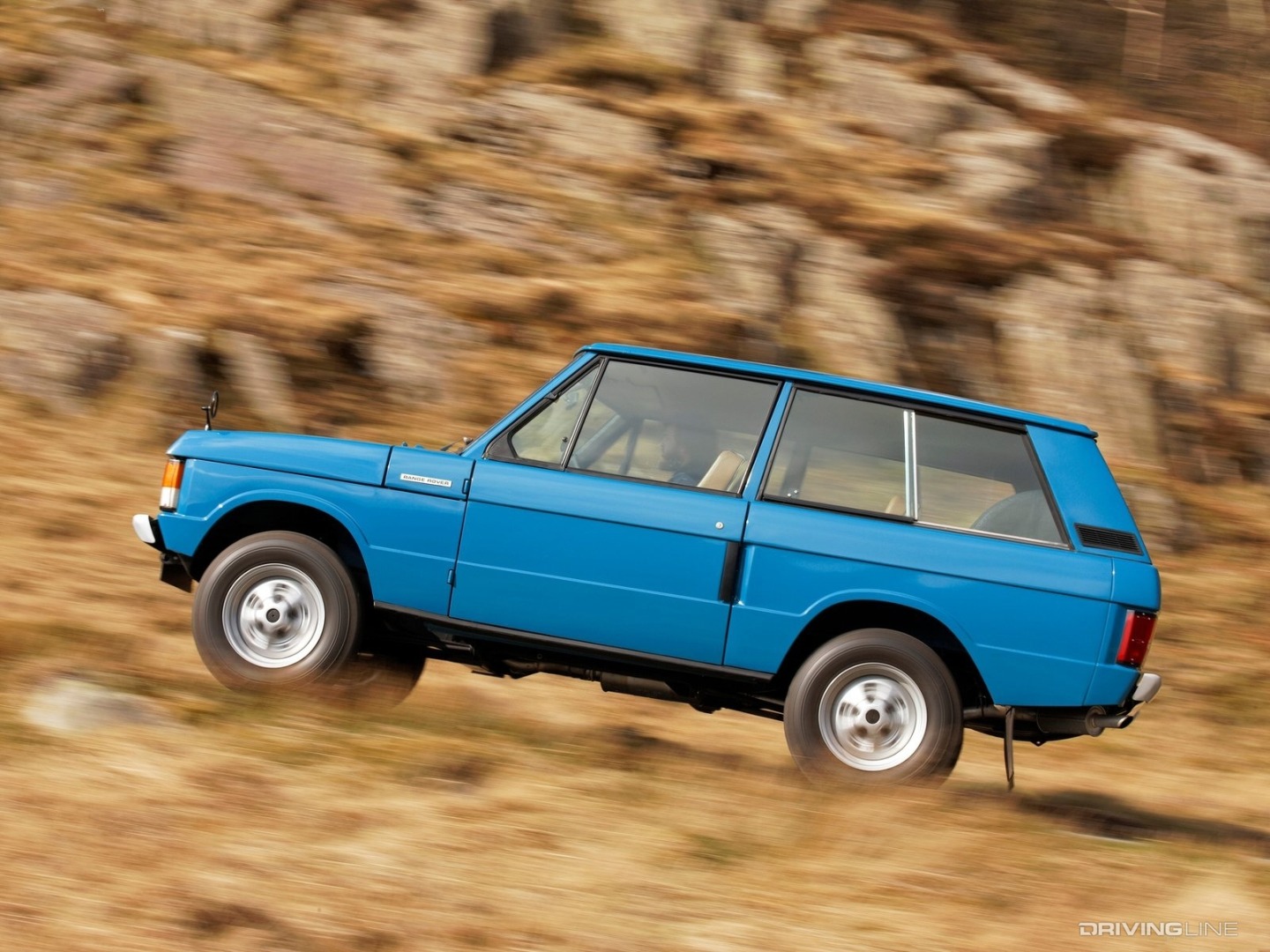 Blue Land Rover Range Rover Classic going uphill