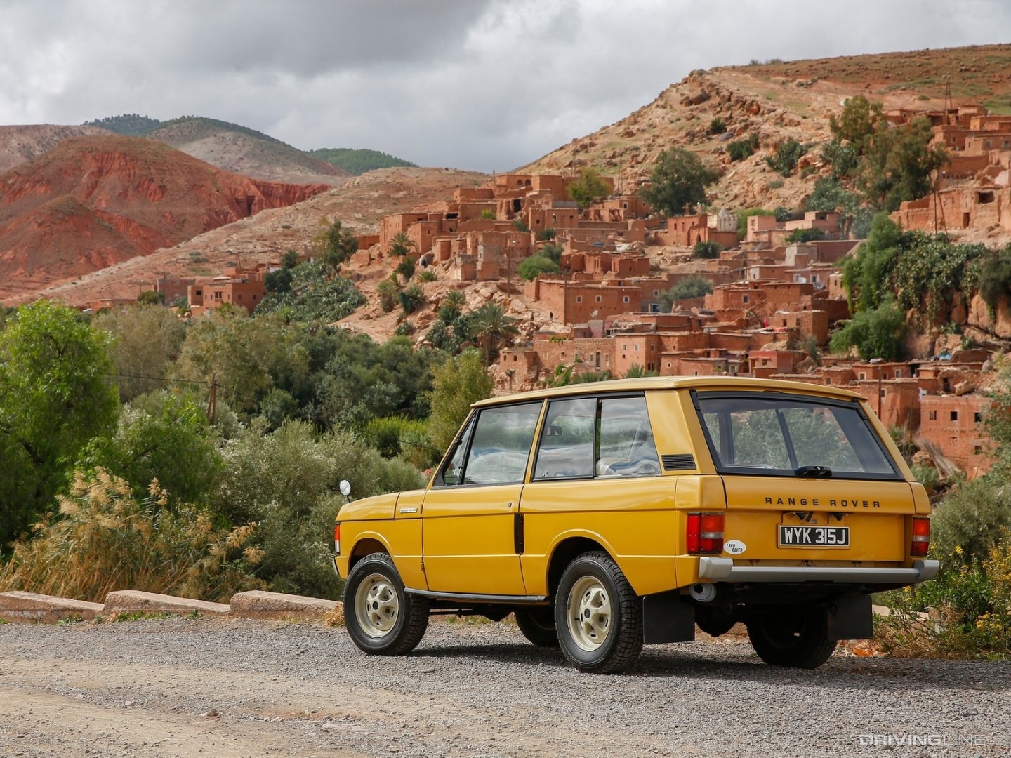 Land Rover Range Rover Classic Yellow parked desert.