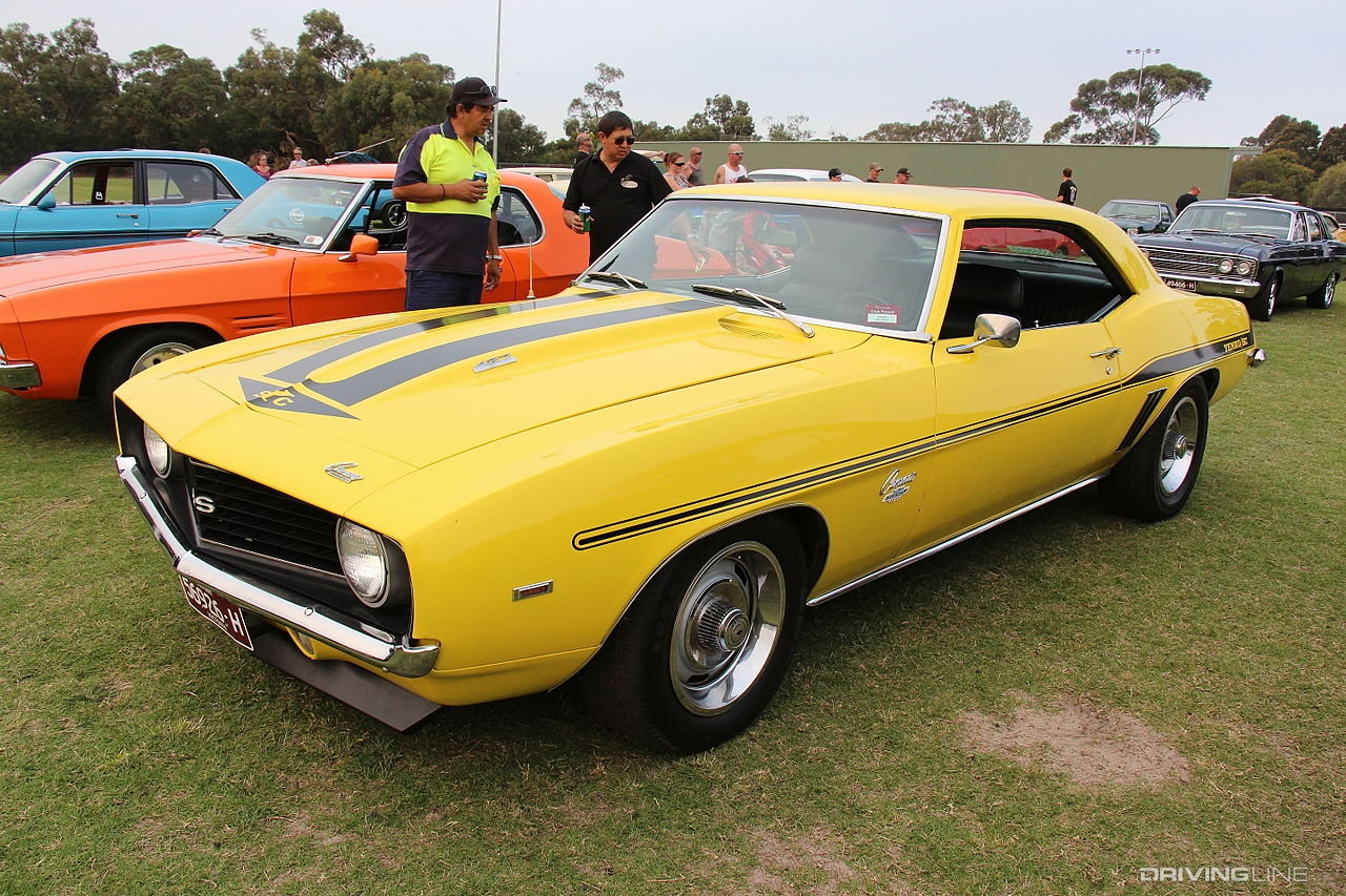 Yellow Yenko Camaro at car show.