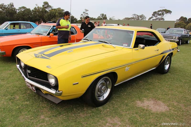 Yellow Yenko Camaro at car show.