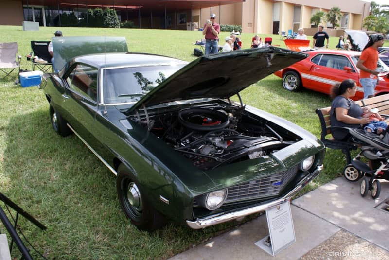 COPO Camaro at car show on grass.