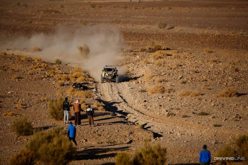 People watching Casey Currie race the Dakar rally