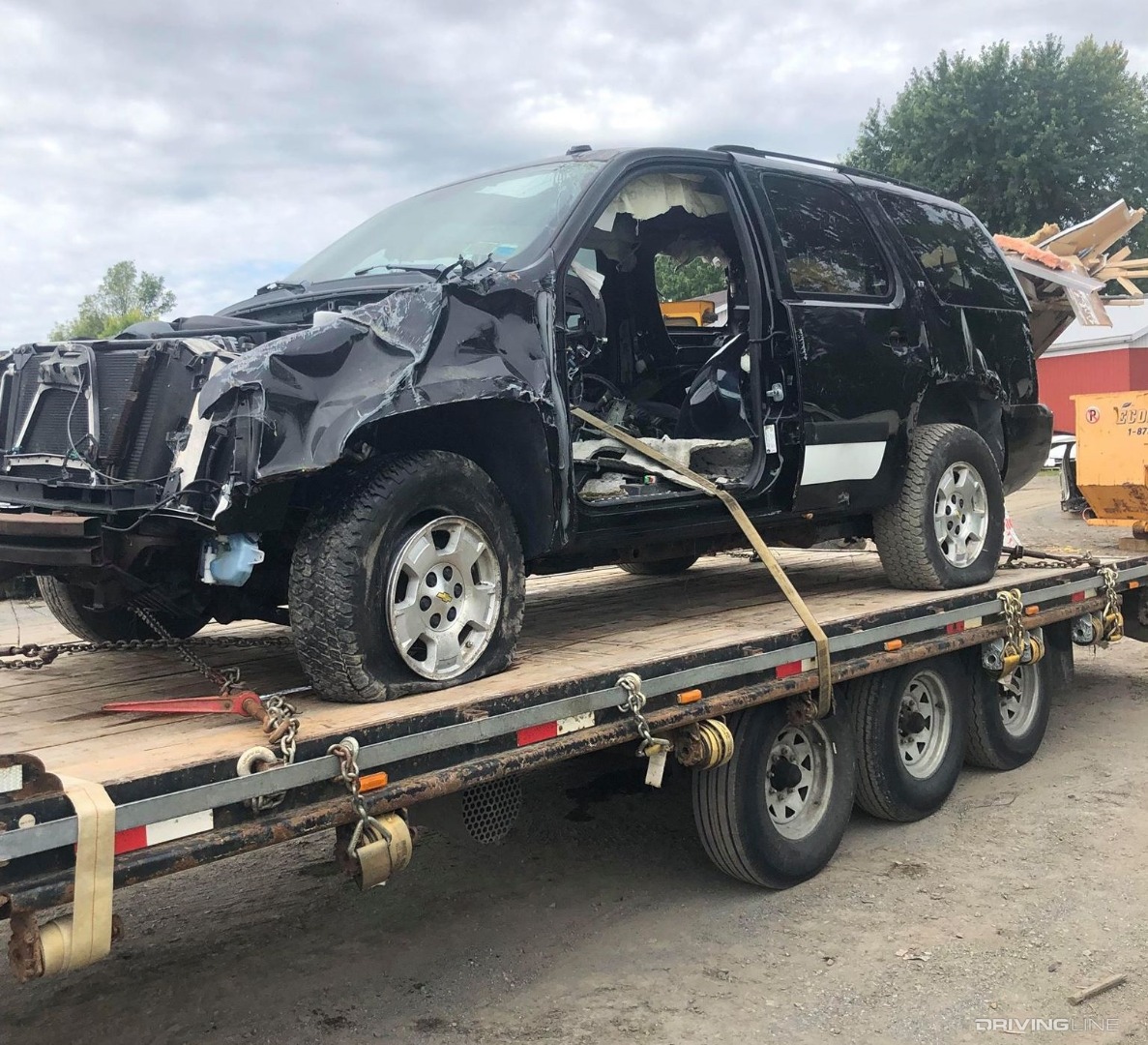 Wrecked 2008 Chevrolet Tahoe on flatbed.