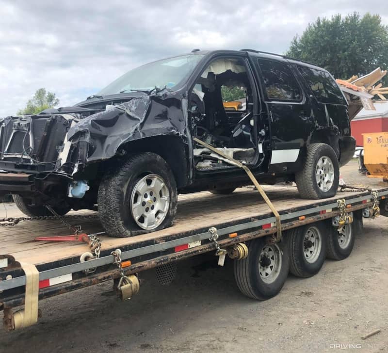 Wrecked 2008 Chevrolet Tahoe on flatbed.