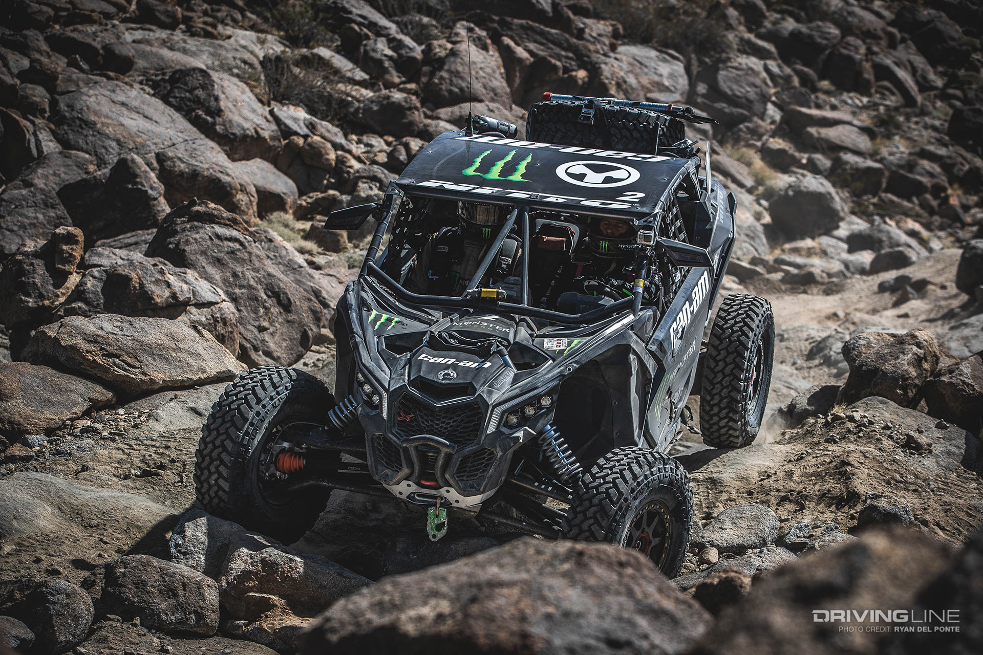 Casey Currie drives his UTV through rocks