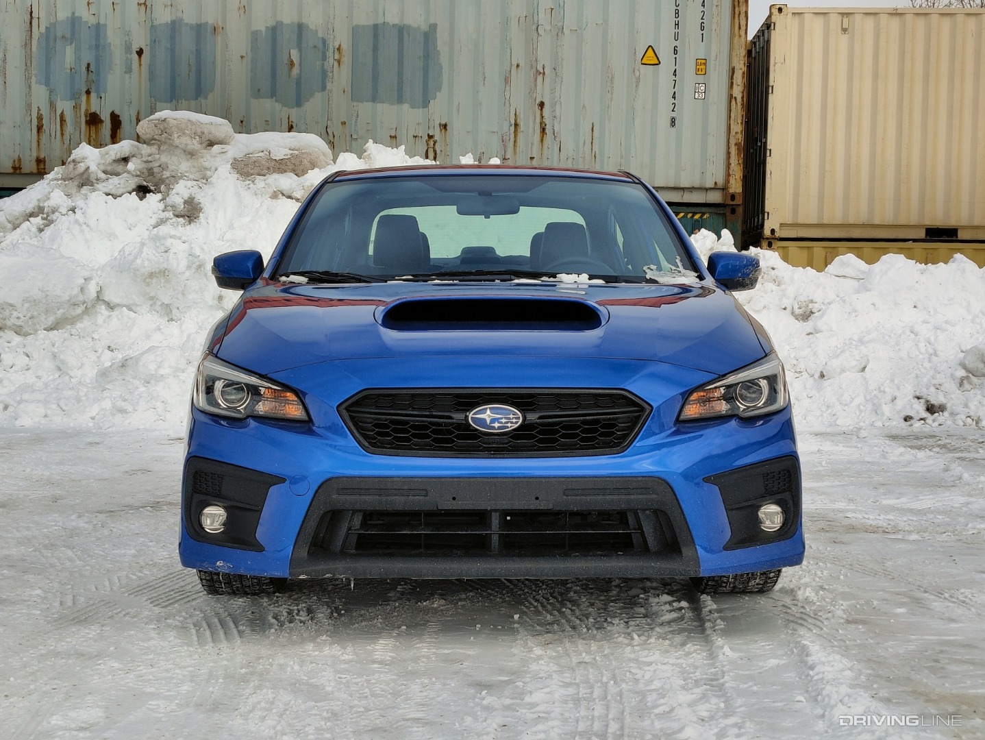 2020 Subaru WRX front view in front of cargo containers