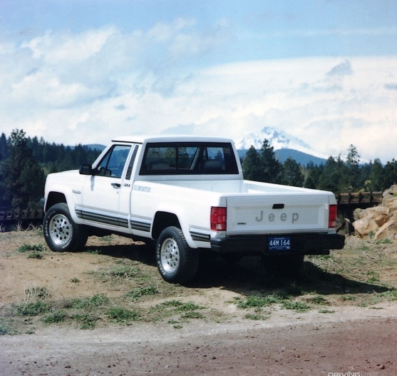 Jeep Comanche white seen from rear.
