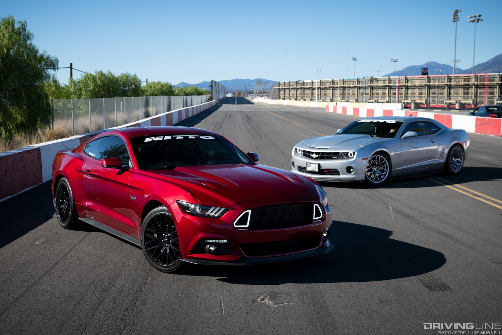 Mustang versus Camaro at Irwindale drag strip driver battles