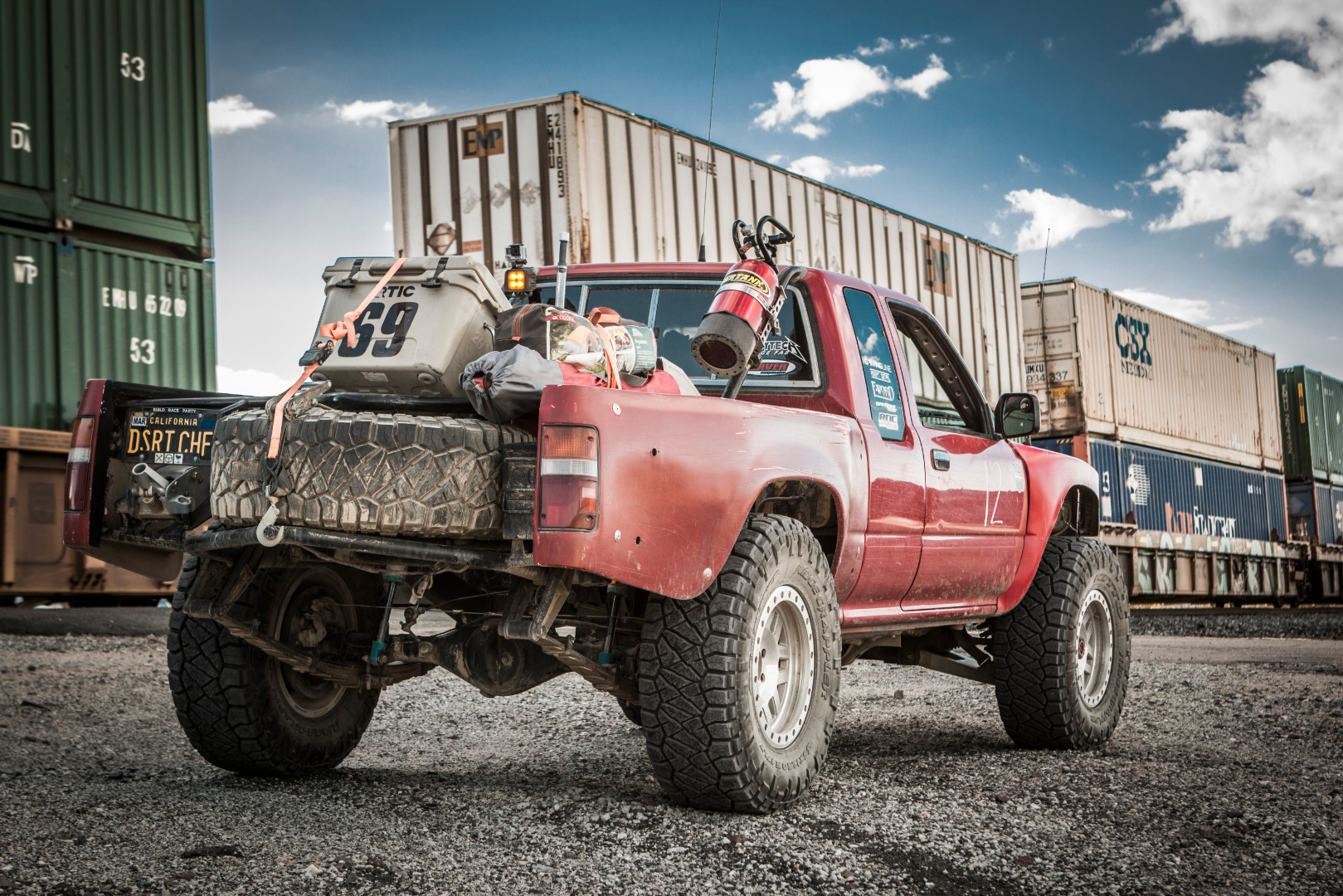Ridge Grapplers on Toyota truck near a train