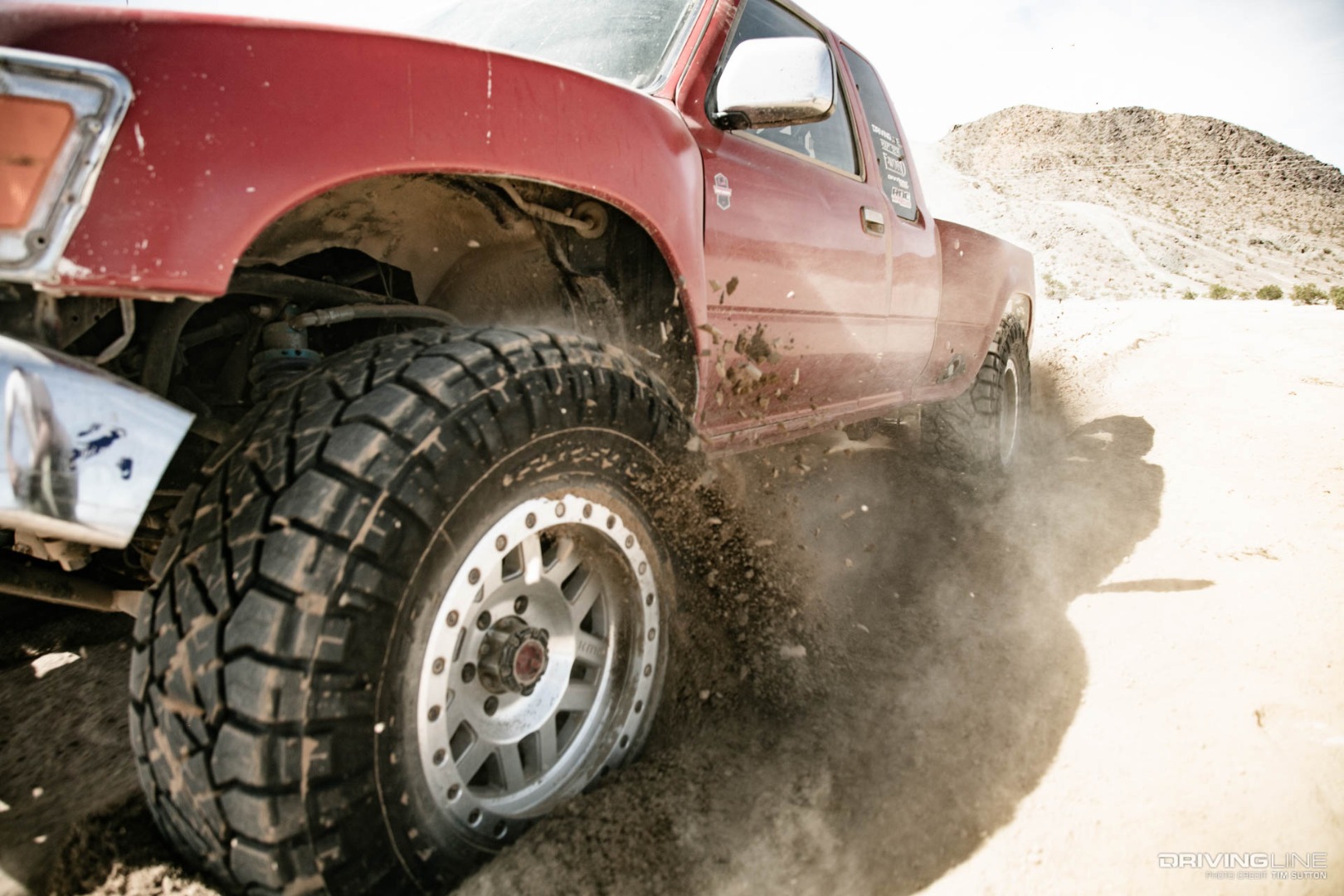 Nitto Ridge Grapplers on Toyota Pickup kicking up dirt