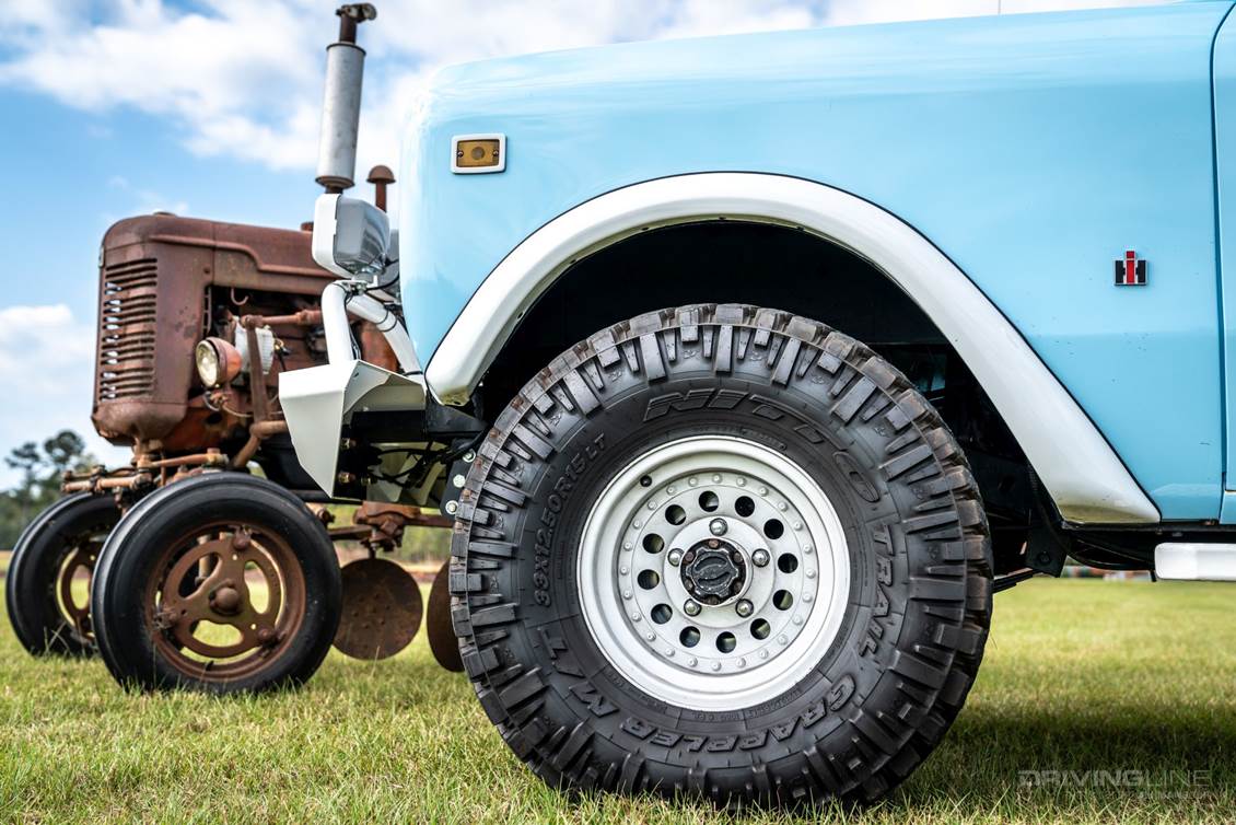 Scout with old tractor