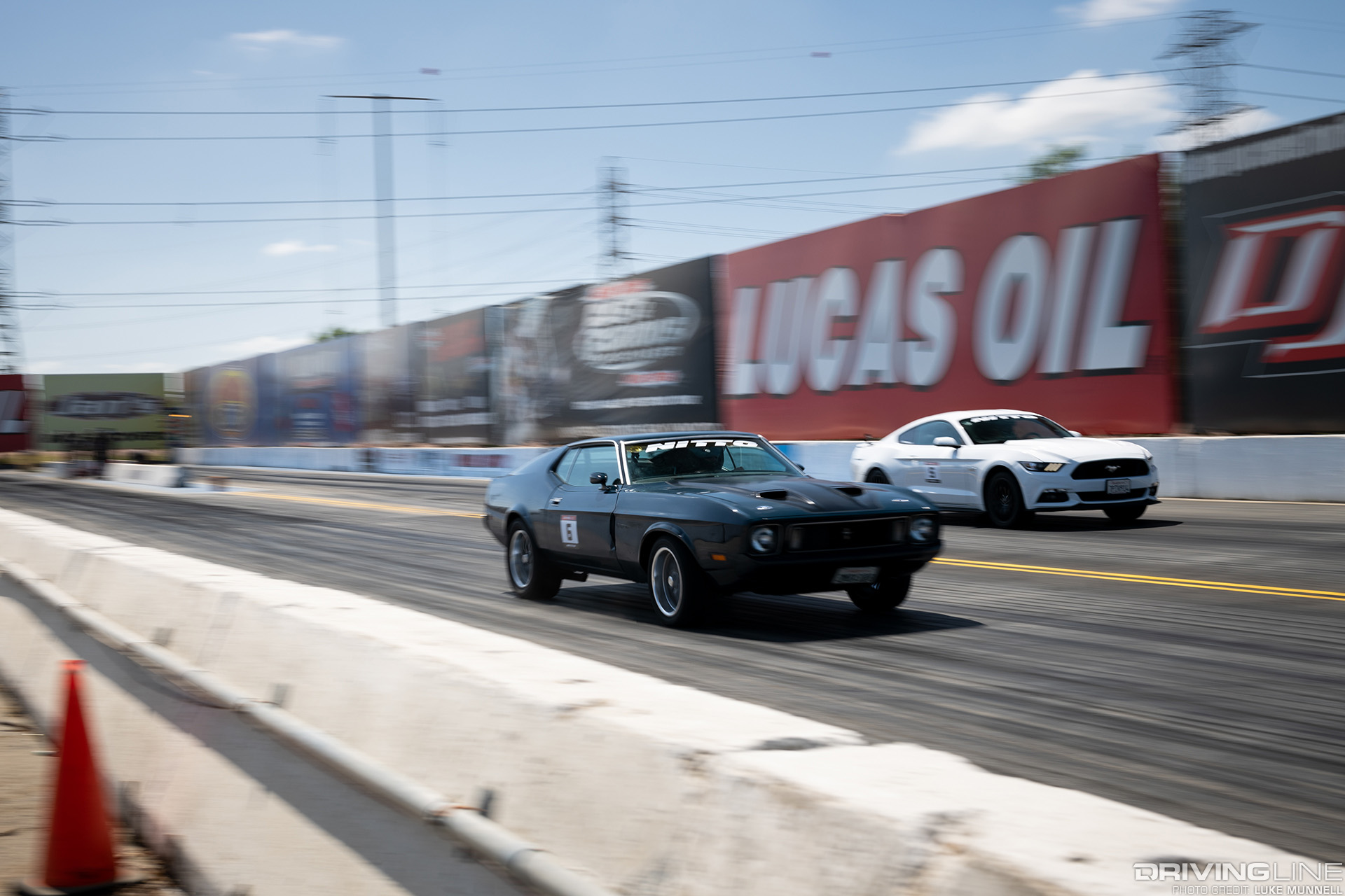 1973 Mustang Mach 1 on Nitto NT555 G2 tires drag racing a 2016 Mustang
