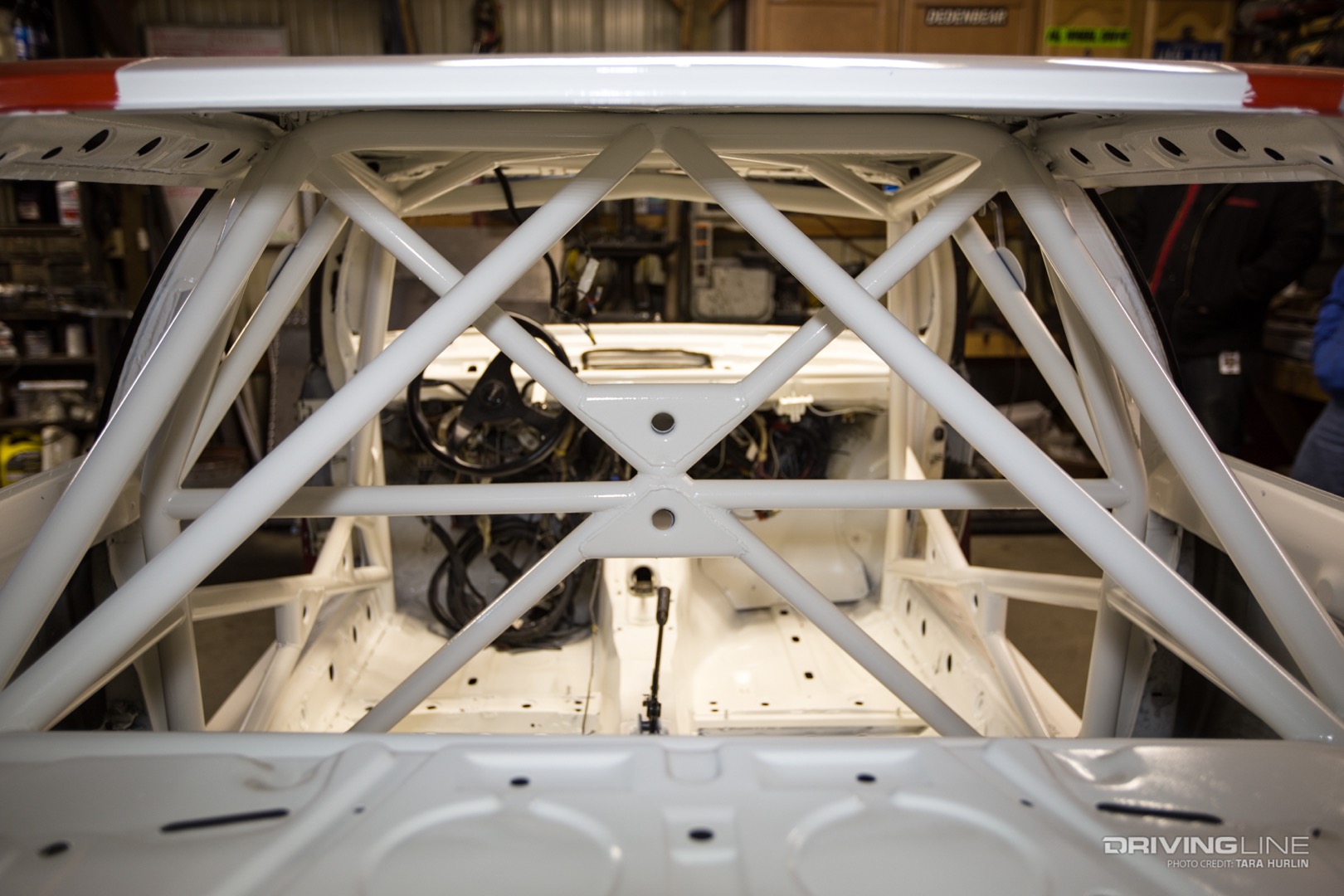 A peek inside of a rally car reveals a fresh custom roll cage.