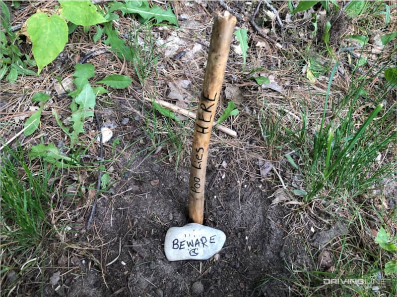 Be responsible and warn others after burying your poo.