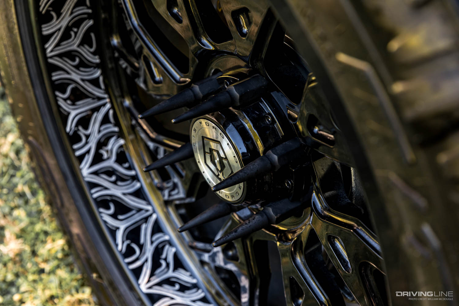 Lug nut spikes and wheel engraving detail on Hanro Ford Expedition