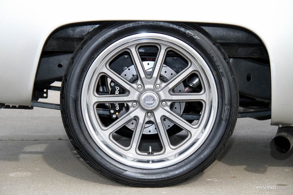 Lowered truck on Nittos close up of wheel-well