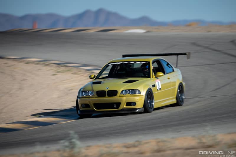 2002 BMW E46 M3 racing on a track