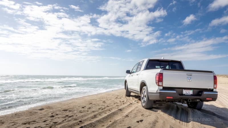 Honda Ridgeline on the beach sand driving