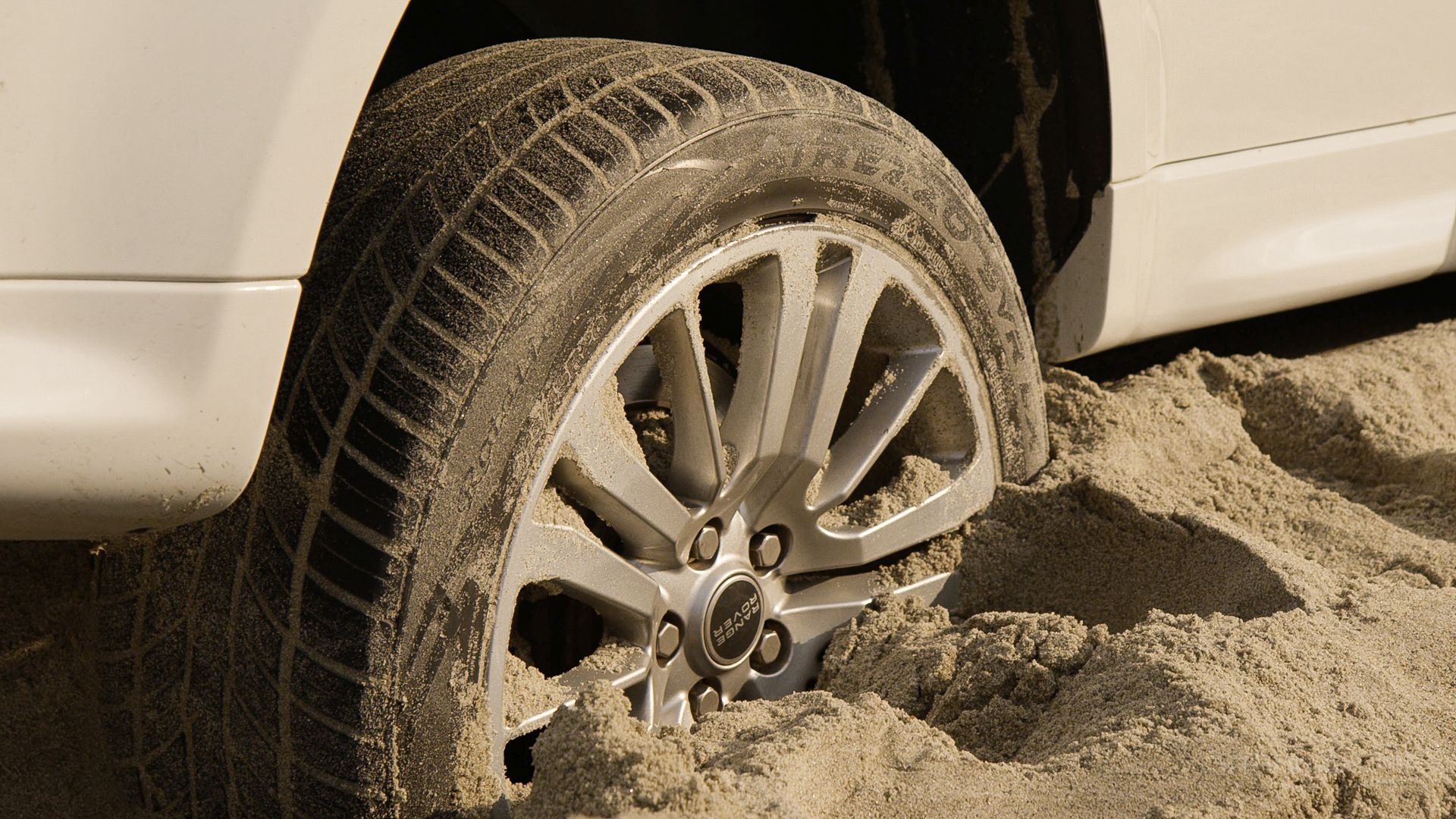 Stuck land rover on beach