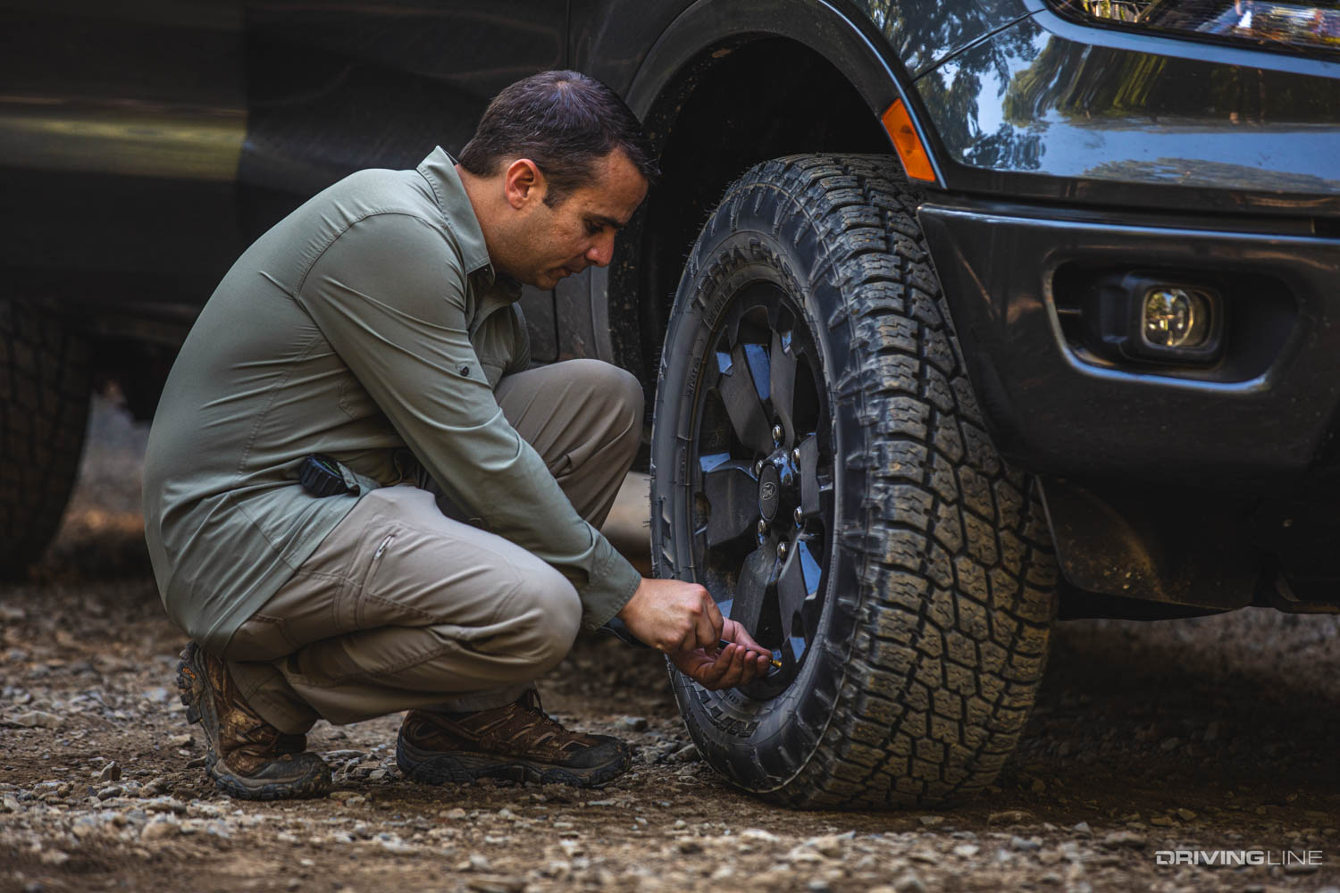 Ali airing down Nitto Terra Grappler G2 tires on a Ford Ranger
