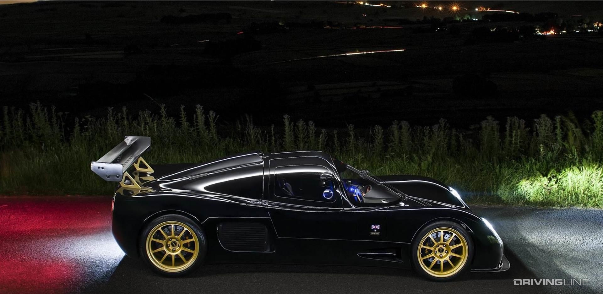 Ultima Evolution Coupe black at night parked