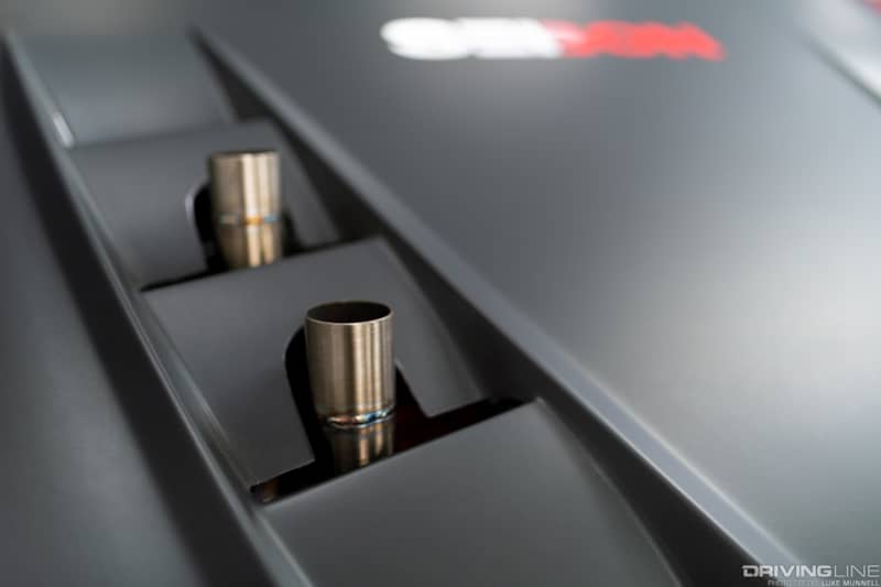 The twin Tial wastegates expel excess boost through the hood