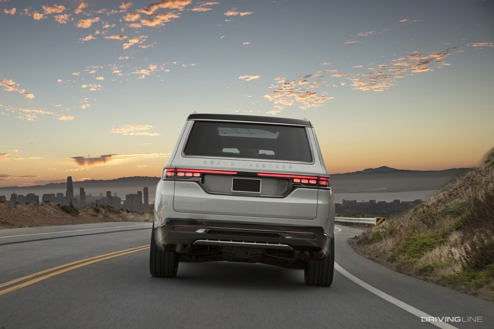 2021 Jeep Grand Wagoneer Concept white rear view on highway