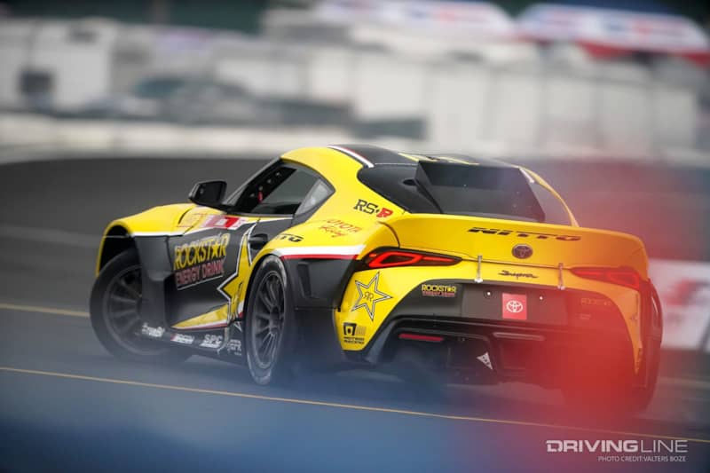 Fredric Aasbo slides his Toyota GR Supra across a wet track at Evergreen Speedway