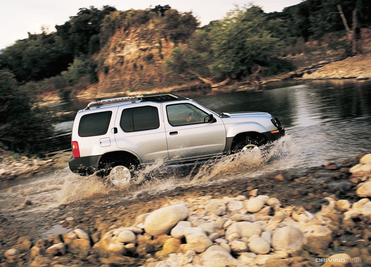 Nissan Xterra blasting through water