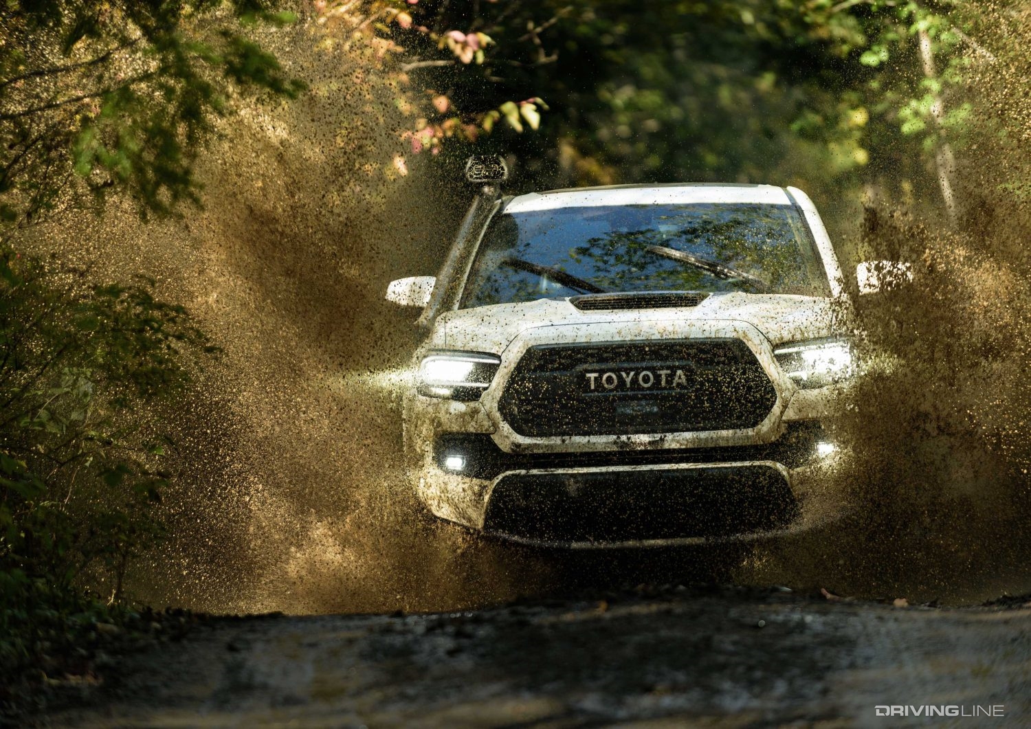 Toyota Tacoma TRD Pro splashing through mud