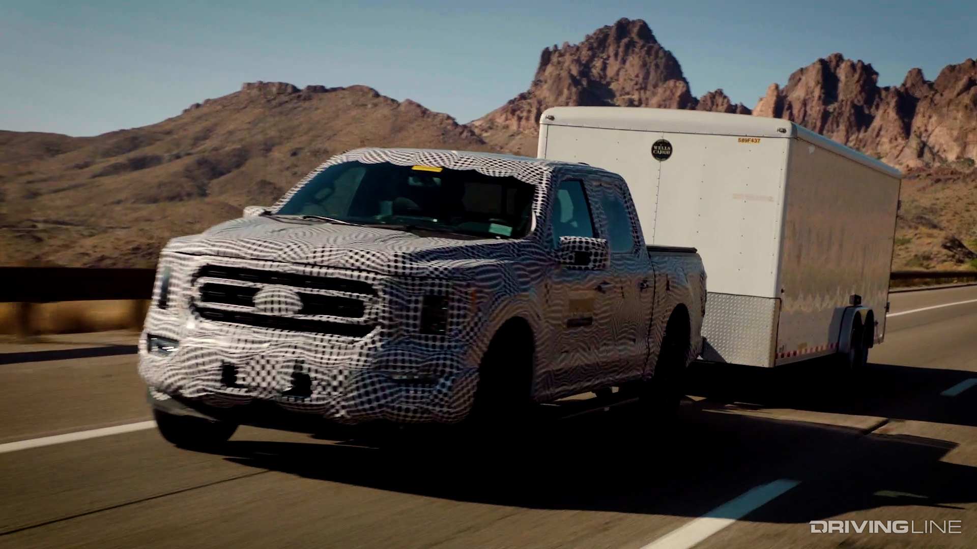 2021 Ford F-150 Hybrid in Camouflage Towing Trailer