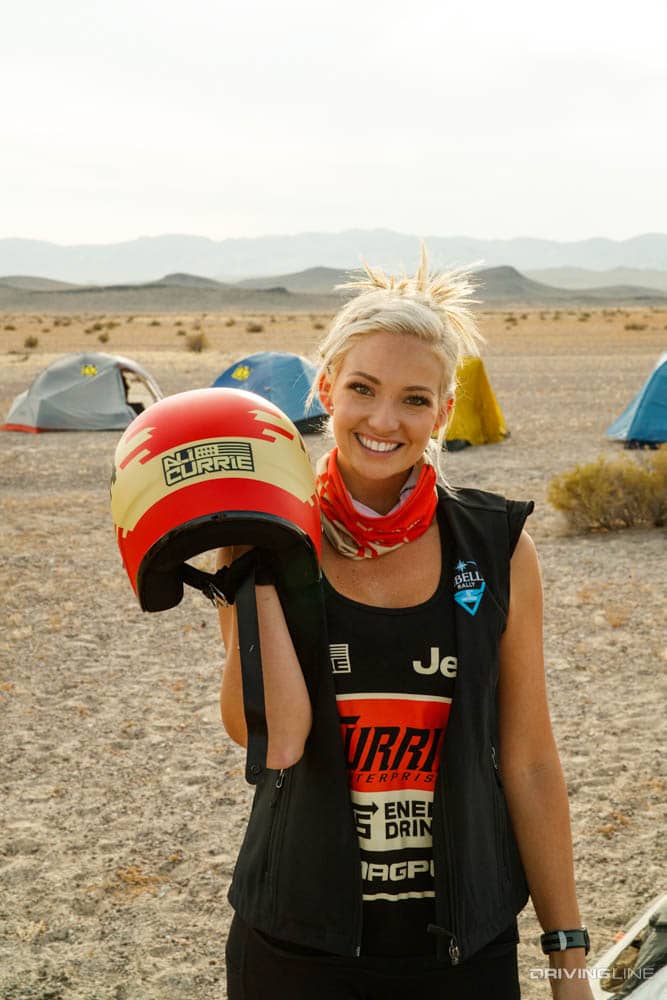 Ali Currie holding helmet at 2020 Rebelle Rally