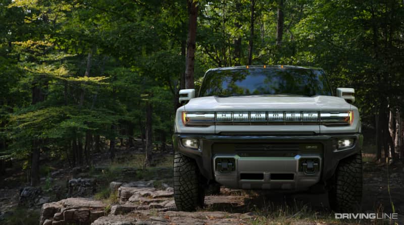 Hummer EV Front On Rocky Trail In Forest