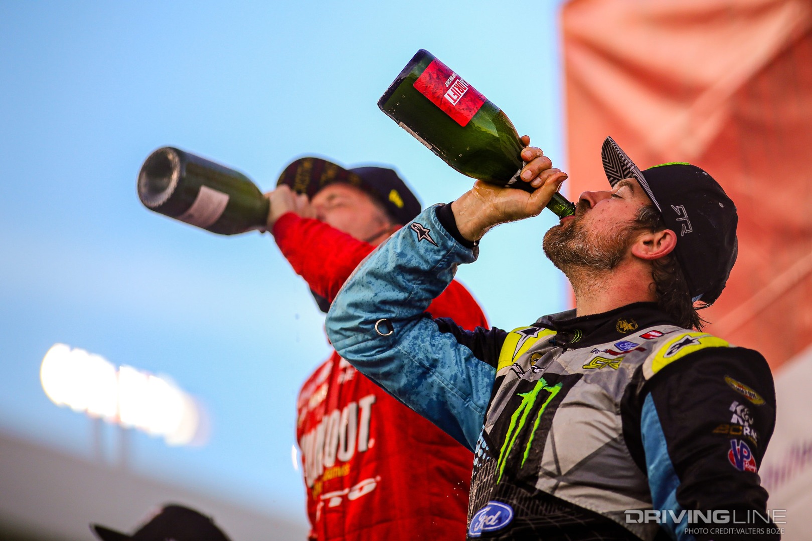 Ryan Tuerck (left) and Vaughn Gittin Jr. (right) sip champagne after Tuerck won Formula Drift Rd 5 and Gittin Jr. took third place