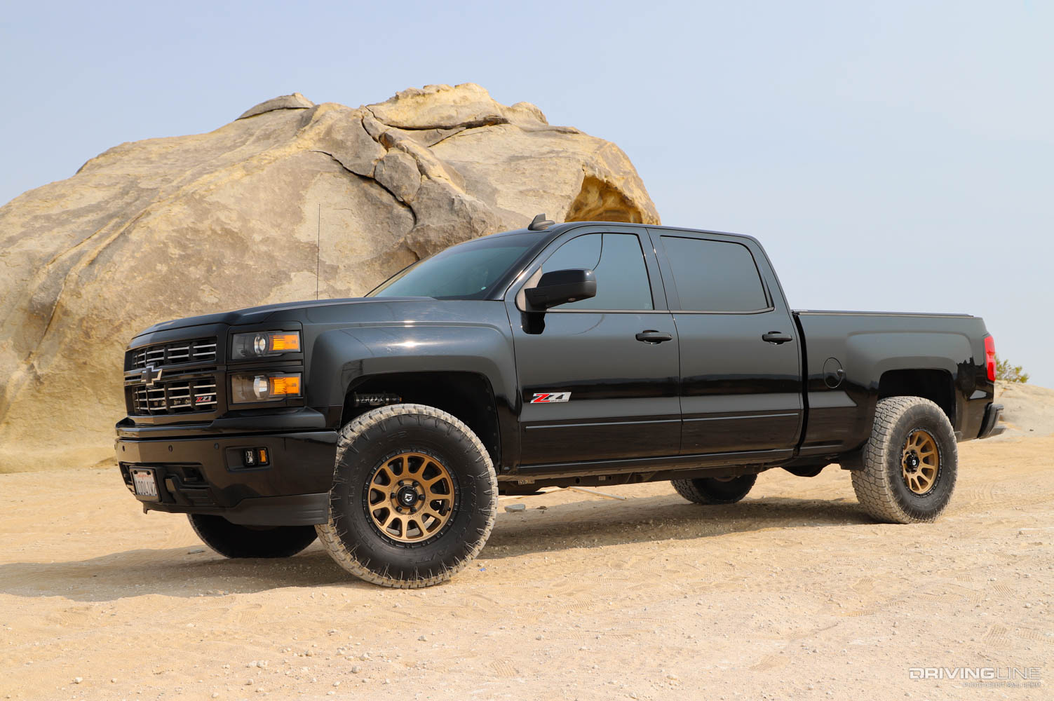 2015 Chevy Silverado with GG lights in grille and Sport Series LED light pods in bumper on Nitto Terra Grappler tires