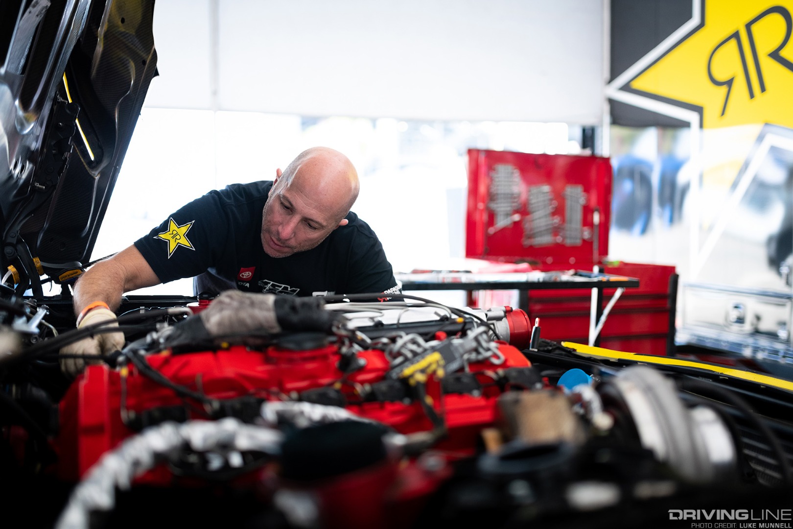 Team Owner Stephan Papadakis wrenches away on Fredric Aasbo's Toyota Supra prior to Formula Drift Round 8