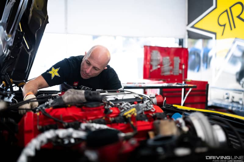 Team Owner Stephan Papadakis wrenches away on Fredric Aasbo's Toyota Supra prior to Formula Drift Round 8