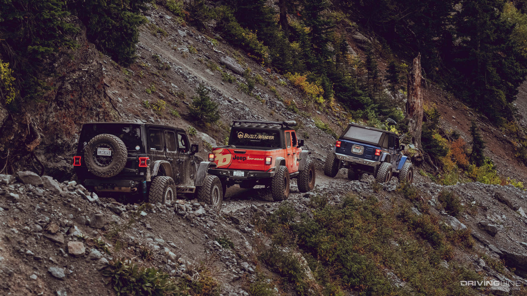 Collin Coates, Mel Wade and Matt Thompson driving their jeeps off road