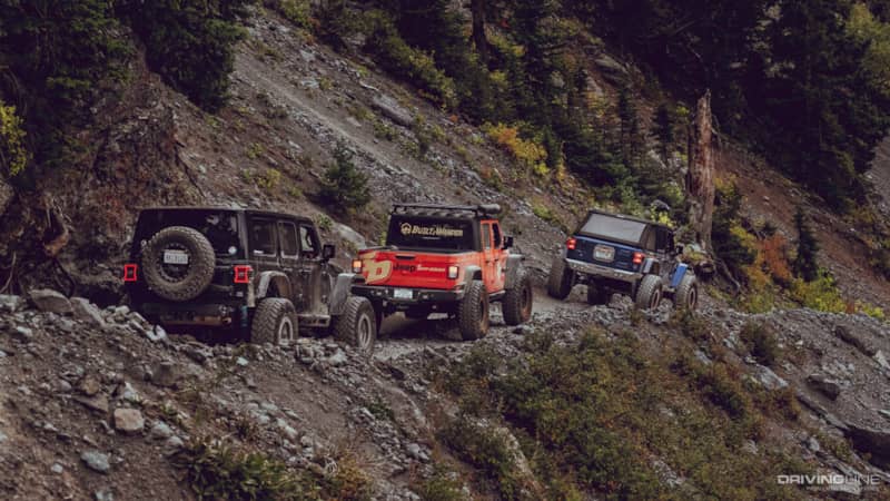 Collin Coates, Mel Wade and Matt Thompson driving their jeeps off road