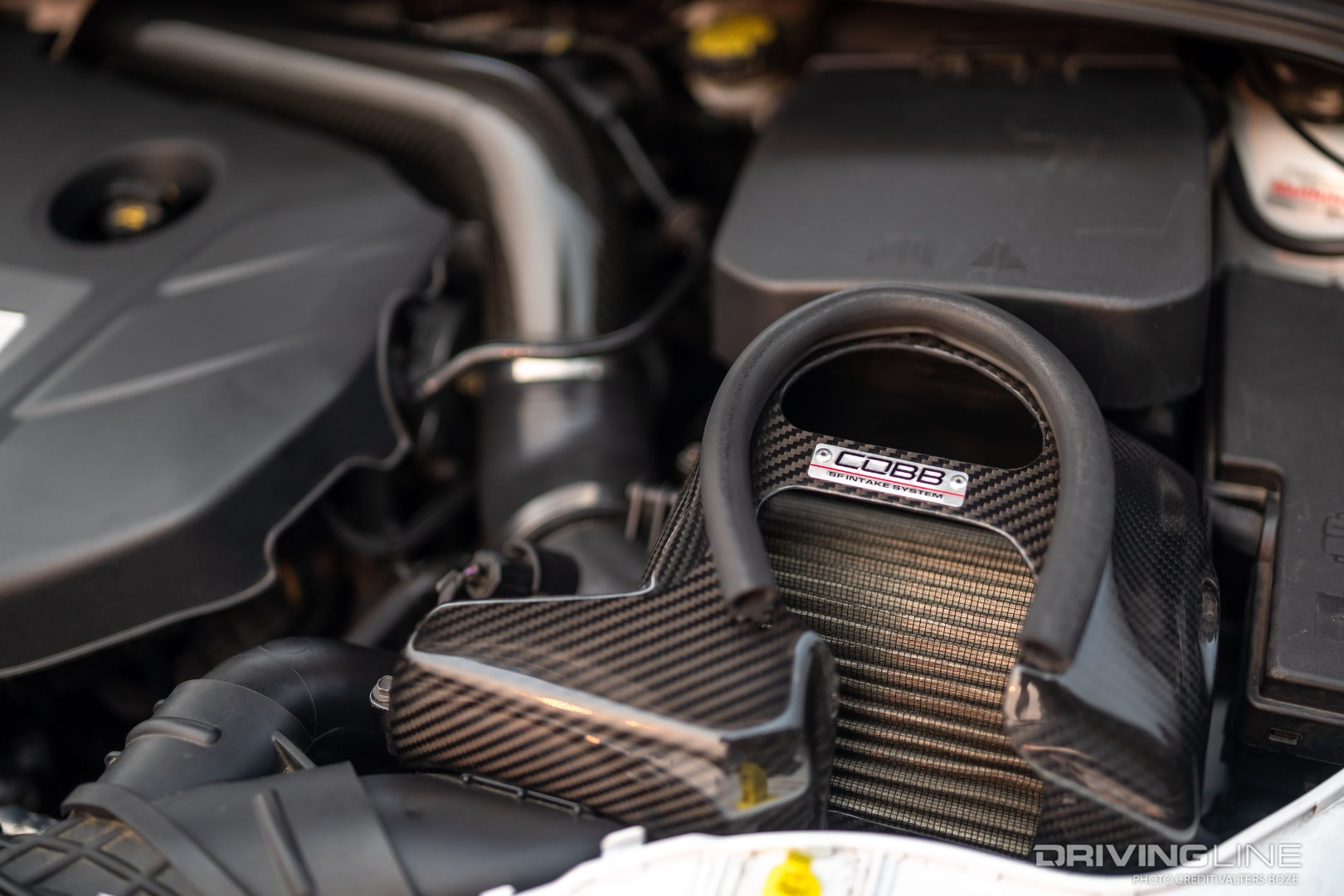 The Cobb Carbon Fiber Intake is fed from the Velossa Big Mouth air intake scoop in the front of Jack's Ford Focus RS