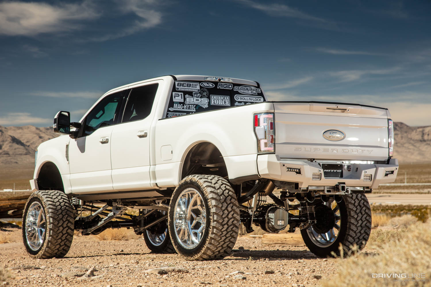 White lifted 2017 Ford Super Duty Truck rear driver side